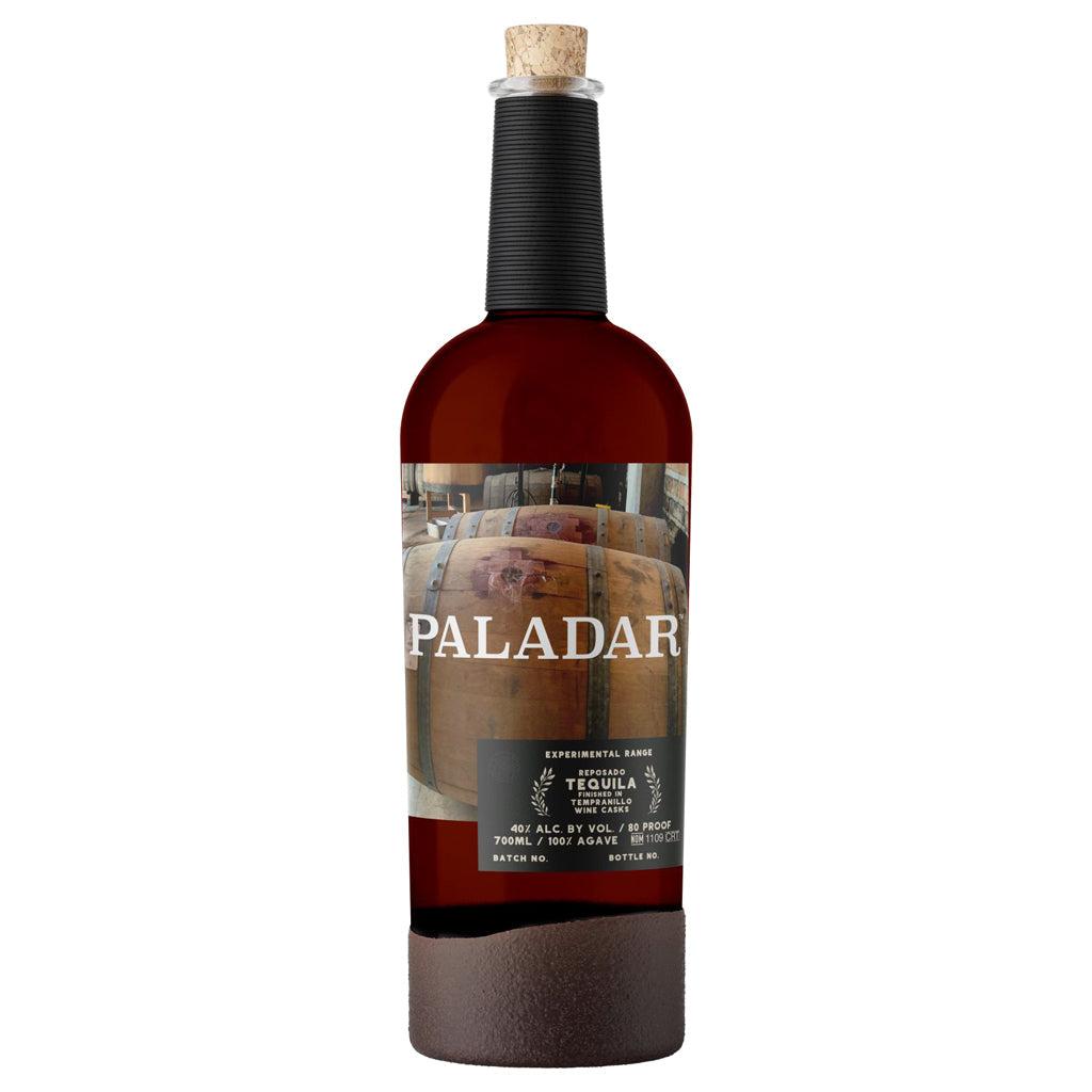 Paladar tequila bottle with a cork on a white background